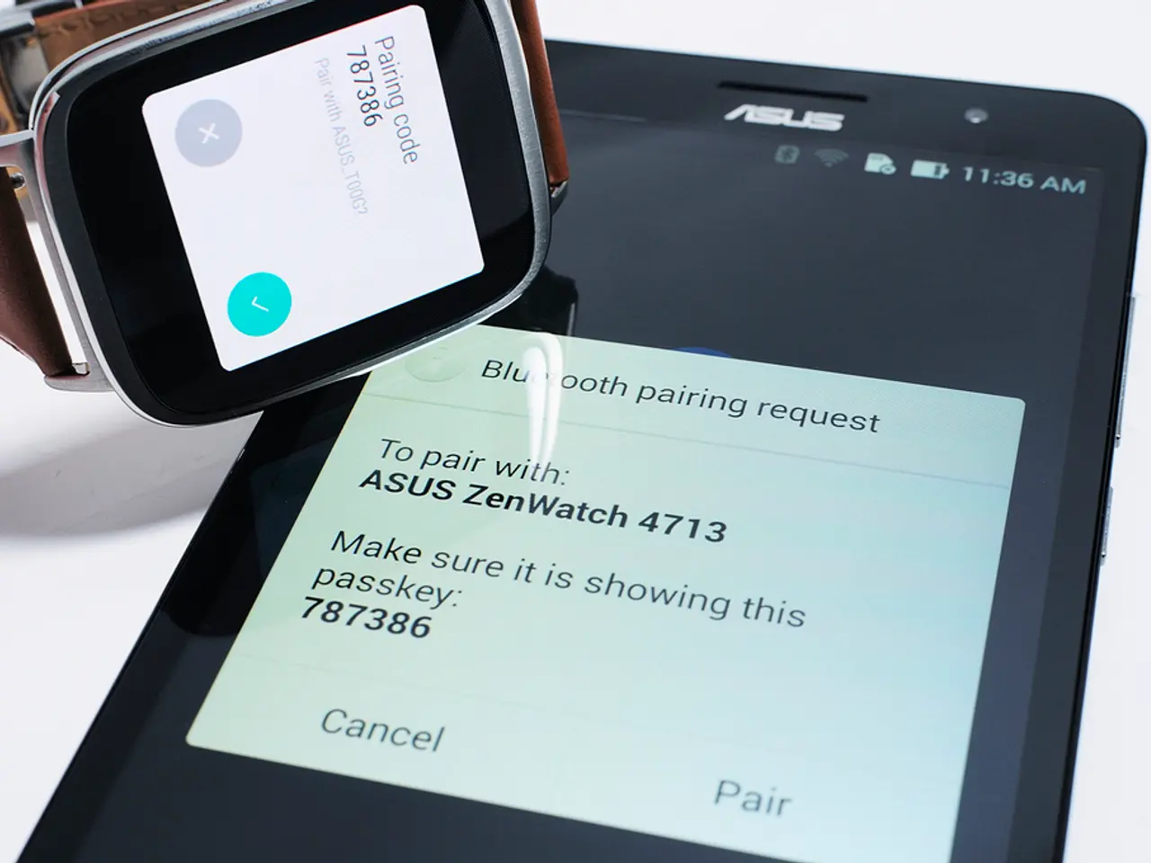 In this image we can see there is a mobile and a watch.