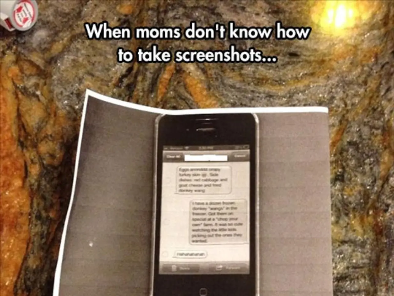 In the picture we can see mobile phone which is on the surface and there is paper in between mobile...