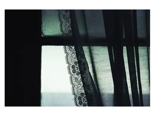 In the image we can see there is a curtain on the window and there is a knitted lace on the window....