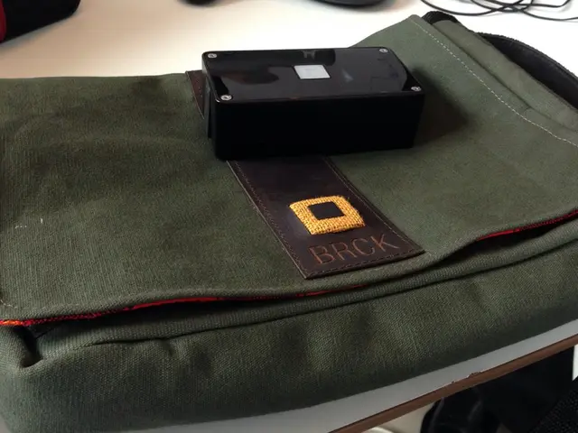 In the picture I can see a bag and earphones on a white color table.