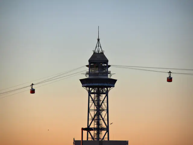 In this picture we can see couple of cable cars and cables, and also we can see a tower.
