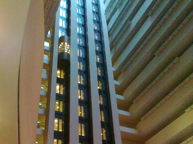 In this image there is a building and we can see there is a lift.