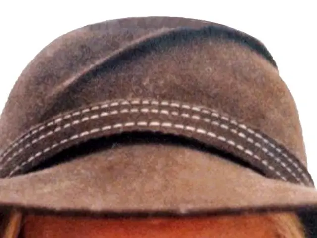 In this image I can see a woman wearing a cap.