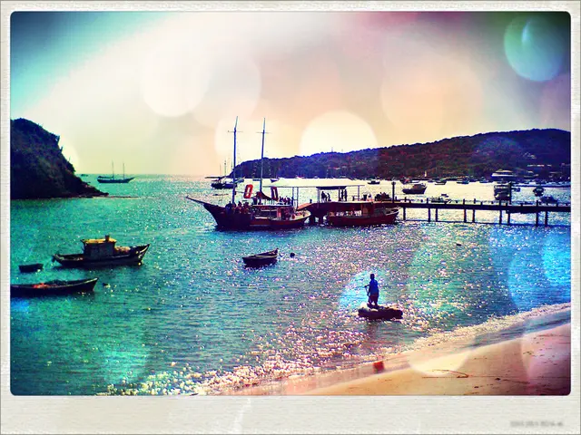 This a photograph and it is on an object. In the photograph we can see boats and ships on the water...